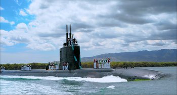 Movie still from “Aircraft Carrier: Guardian of the Seas” (2016), directed by Stephen Low – A group of people standing on the side of a boat; Extreme Wide shot, Low angle