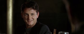 Movie still from “The Game” (1997), directed by David Fincher – A person sitting in front of a camera; Close Up shot, Over the shoulder angle