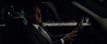 Movie still from “The Game” (1997), directed by David Fincher – A man sitting in a car in the dark; Close Up shot, Over the shoulder angle