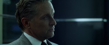 Movie still from “The Game” (1997), directed by David Fincher – An older man wearing a suit and tie looking to his left; Close Up shot, Low angle