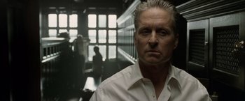 Movie still from “The Game” (1997), directed by David Fincher – An older man in a white dress shirt is in a hallway; Close Up shot, Low angle