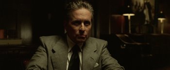 Movie still from “The Game” (1997), directed by David Fincher – A person wearing a suit and tie; Close Up shot, Low angle