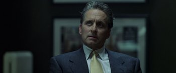 Movie still from “The Game” (1997), directed by David Fincher – A man in a suit and a tie; Close Up shot, Over the shoulder angle