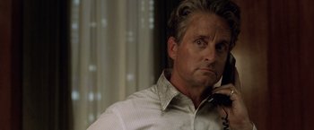 Movie still from “The Game” (1997), directed by David Fincher – A person talking on a cell phone; Close Up shot, Low angle