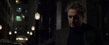 Movie still from “The Game” (1997), directed by David Fincher – A person wearing a suit and tie; Close Up shot, Low angle