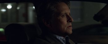 Movie still from “The Game” (1997), directed by David Fincher – A person wearing a suit and tie; Close Up shot, Over the shoulder angle