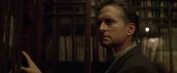 Movie still from “The Game” (1997), directed by David Fincher – A person wearing a jacket in a room; Close Up shot, Low angle