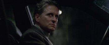 Movie still from “The Game” (1997), directed by David Fincher – A person holding an open umbrella; Close Up shot, Low angle