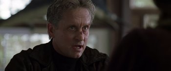 Movie still from “The Game” (1997), directed by David Fincher – A person wearing a black jacket; Close Up shot, Over the shoulder angle