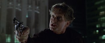 Movie still from “The Game” (1997), directed by David Fincher – A person wearing a black shirt; Close Up shot, Low angle