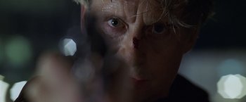 Movie still from “The Game” (1997), directed by David Fincher – A person's face with blood on his face; Extreme Close Up shot, Low angle