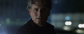 Movie still from “The Game” (1997), directed by David Fincher – An older man with curly gray hair stares into the camera; Close Up shot, Low angle