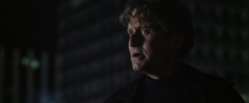 Movie still from “The Game” (1997), directed by David Fincher – A person looking at the camera; Close Up shot, Low angle