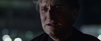 Movie still from “The Game” (1997), directed by David Fincher – A man's face in the dark; Close Up shot, Low angle