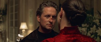 Movie still from “The Game” (1997), directed by David Fincher – A man looking at a woman in the mirror; Close Up shot, Over the shoulder angle