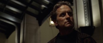 Movie still from “The Game” (1997), directed by David Fincher – A person wearing a black jacket; Close Up shot, Low angle