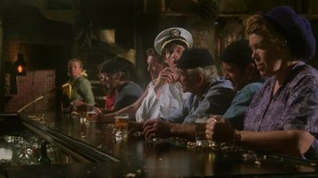 Movie still from “Airplane!” (1980), directed by David Zucker – A group of men sitting at a bar drinking beer; Wide shot, Over the shoulder angle