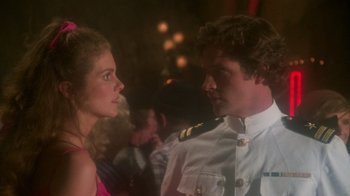 Movie still from “Airplane!” (1980), directed by David Zucker – A man and a woman are talking to each other; Close Up shot, Over the shoulder angle