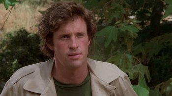 Movie still from “Airplane!” (1980), directed by David Zucker – A person wearing a jacket near a tree; Close Up shot, Low angle