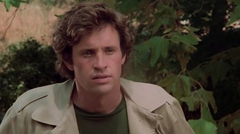 Movie still from “Airplane!” (1980), directed by David Zucker – A person wearing a trench coat; Close Up shot, Low angle