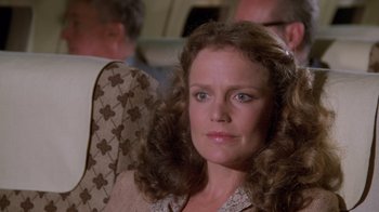 Movie still from “Airplane!” (1980), directed by David Zucker – A person with curly hair; Close Up shot, Low angle