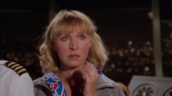 Movie still from “Airplane!” (1980), directed by David Zucker – A person wearing a jacket; Close Up shot, Over the shoulder angle