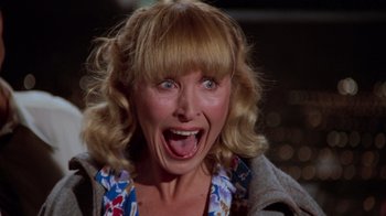 Movie still from “Airplane!” (1980), directed by David Zucker – A person with a mouth wide open; Close Up shot, Low angle