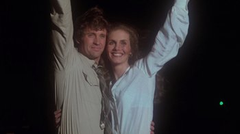 Movie still from “Airplane!” (1980), directed by David Zucker – A man and a woman standing next to each other; Medium shot, Low angle