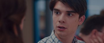 Movie still from “Alex Strangelove” (2018), directed by Craig Johnson – A person wearing a plaid shirt; Close Up shot, Over the shoulder angle