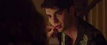 Movie still from “Alex Strangelove” (2018), directed by Craig Johnson – A young man looking at his reflection in a mirror; Close Up shot, Over the shoulder angle