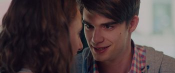 Movie still from “Alex Strangelove” (2018), directed by Craig Johnson – A young man and a young woman face to face; Close Up shot, Over the shoulder angle