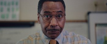Movie still from “Alex Strangelove” (2018), directed by Craig Johnson – A person wearing glasses and a tie; Close Up shot, Low angle