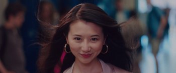 Movie still from “Alex Strangelove” (2018), directed by Craig Johnson – A person with long brown hair; Close Up shot, Low angle