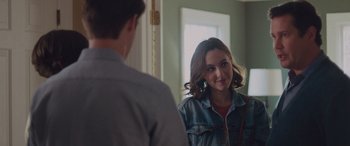 Movie still from “Alex Strangelove” (2018), directed by Craig Johnson – A young woman looking at a man in a mirror; Close Up shot, Over the shoulder angle