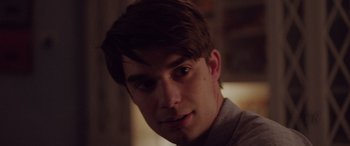 Movie still from “Alex Strangelove” (2018), directed by Craig Johnson – A person wearing a white shirt; Close Up shot, Over the shoulder angle