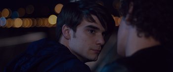 Movie still from “Alex Strangelove” (2018), directed by Craig Johnson – A person wearing a black shirt; Close Up shot, Over the shoulder angle
