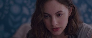 Movie still from “Alex Strangelove” (2018), directed by Craig Johnson – A person with long hair; Close Up shot, Over the shoulder angle