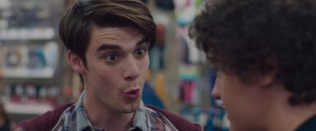 Movie still from “Alex Strangelove” (2018), directed by Craig Johnson – A young man with a surprised look on his face; Close Up shot, Over the shoulder angle