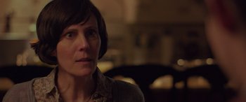 Movie still from “Alex Strangelove” (2018), directed by Craig Johnson – A person with short brown hair; Close Up shot, Over the shoulder angle