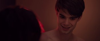 Movie still from “Alex Strangelove” (2018), directed by Craig Johnson – A young man is looking into a mirror; Close Up shot, Over the shoulder angle