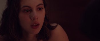 Movie still from “Alex Strangelove” (2018), directed by Craig Johnson – A woman's face in a dark room; Close Up shot, Over the shoulder angle