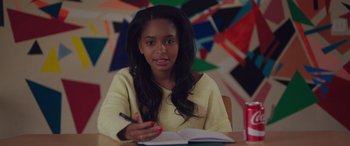 Movie still from “Alex Strangelove” (2018), directed by Craig Johnson – A young woman is writing in a notebook; Close Up shot, Over the shoulder angle