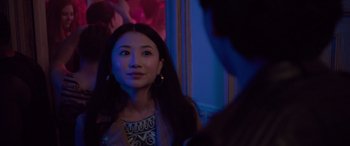Movie still from “Alex Strangelove” (2018), directed by Craig Johnson – A woman is looking at a man in a blue room; Close Up shot, Over the shoulder angle