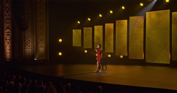 Movie still from “Ali Wong: Don Wong” (2022), directed by Nahnatchka Khan – A woman standing on a stage in front of an audience; Extreme Wide shot, High angle
