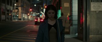 Movie still from “Alice, Darling” (2022), directed by Mary Nighy – A woman is walking down the street at night; Medium shot, High angle
