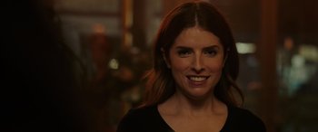 Movie still from “Alice, Darling” (2022), directed by Mary Nighy – A person smiling for the camera; Close Up shot, Over the shoulder angle