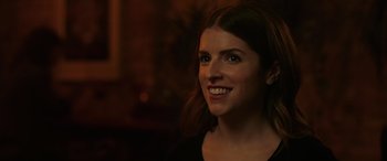 Movie still from “Alice, Darling” (2022), directed by Mary Nighy – A person smiling at the camera; Close Up shot, Over the shoulder angle