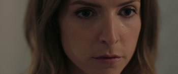 Movie still from “Alice, Darling” (2022), directed by Mary Nighy – A woman's face with a lot of skin on her face; Extreme Close Up shot, Low angle