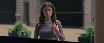 Movie still from “Alice, Darling” (2022), directed by Mary Nighy – A beautiful young woman standing in front of a mirror; Medium shot, Over the shoulder angle