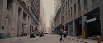 Movie still from “Alice, Darling” (2022), directed by Mary Nighy – A man and a woman crossing a street in a city; Wide shot, Low angle